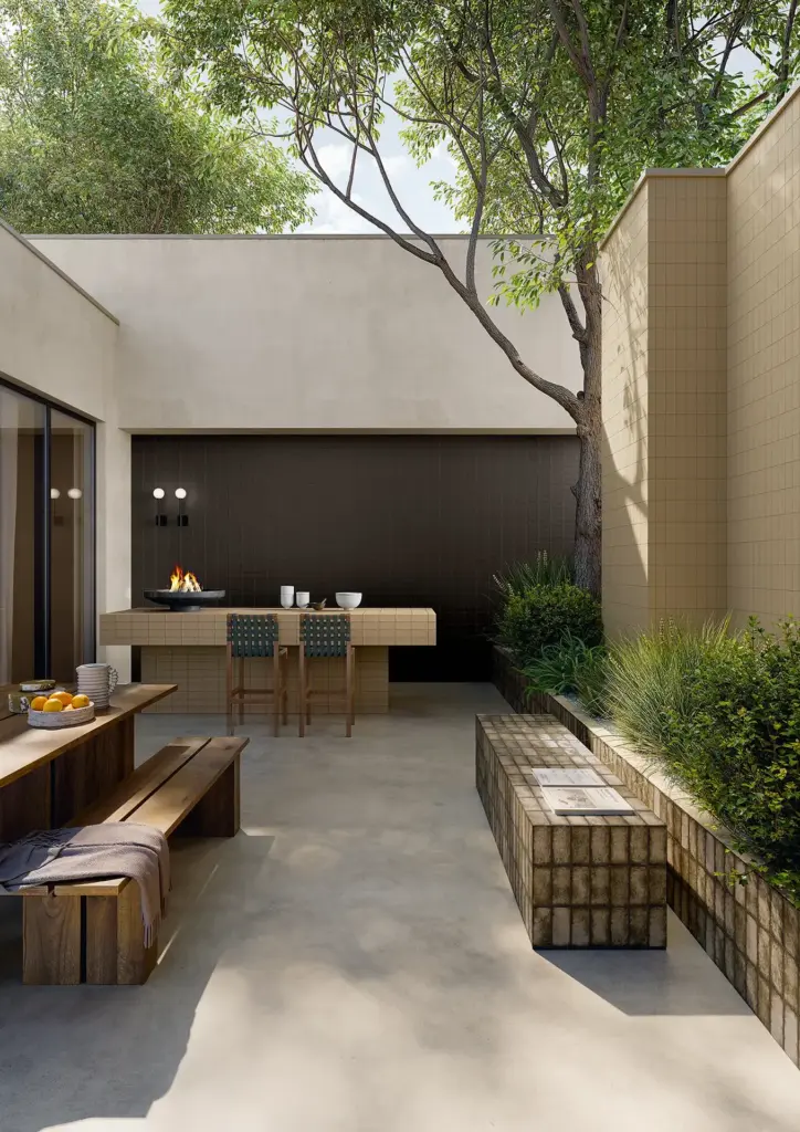Berlese tiles: an outdoor courtyard with tiled walls, planters and an outdoor kitchen