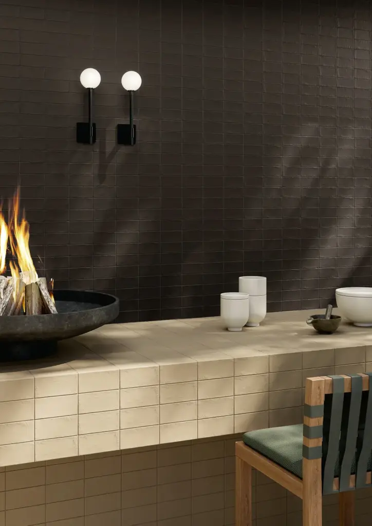 Berlese tiles: an outdoor kitchen counter below a Black wall