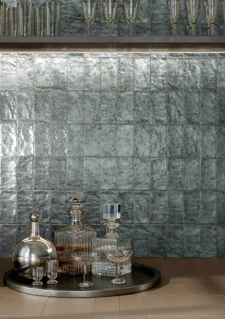 Berlese tiles: an Aluna Argento wall behind a drinks tray, close up