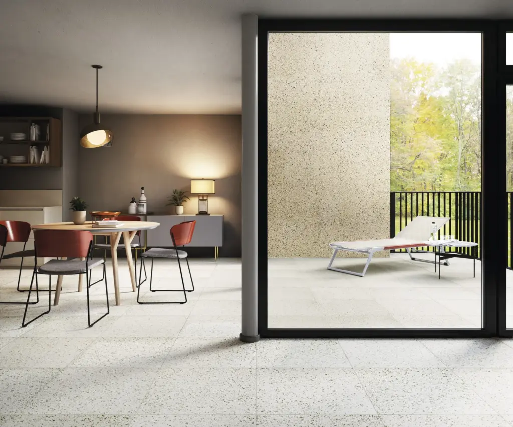 Rialto tiles: a dining room with a Zinc floor opening onto a terrace