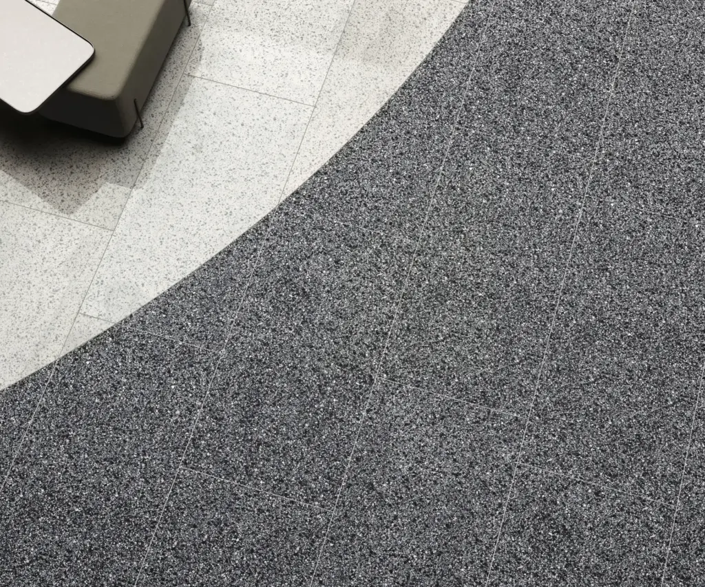 Rialto tiles: a Graphite floor meeting a lighter border, close up